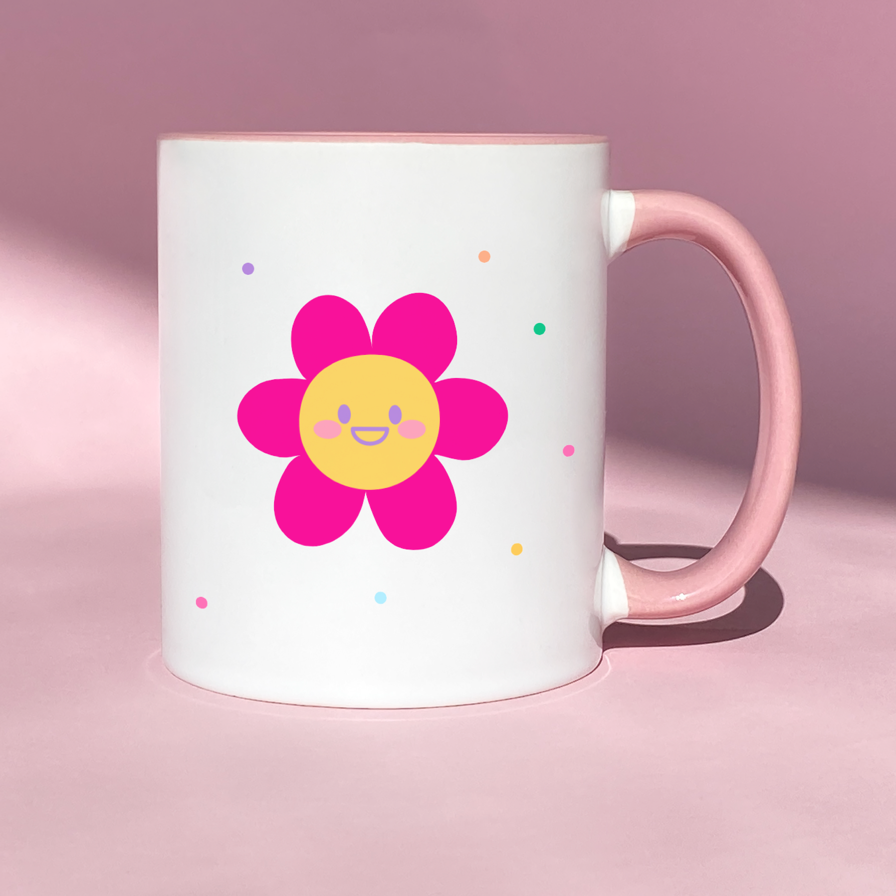 Colorful ceramic mug with the phrase 'Do the Things That Make You Sona Sásta' and vibrant spots, featuring a pink flower on the reverse