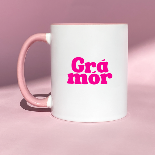 White ceramic mug with the Irish phrase 'Grá Mór' in minimalist design & funky font, meaning big love as Gaeilge.